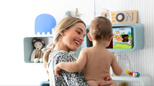 mom holding baby in nursery